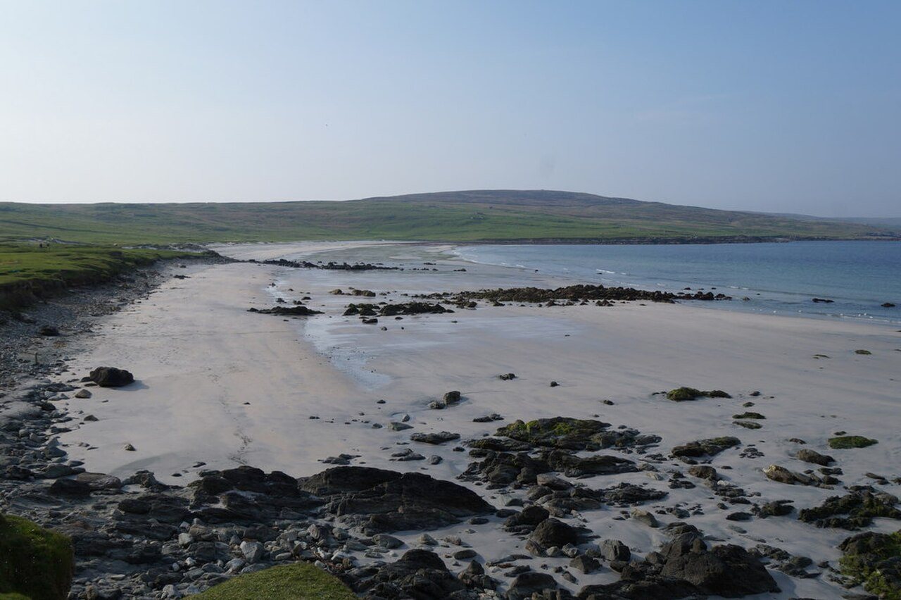 Low tide on a Scottish shore, illustrating the changing area of exposed beach.