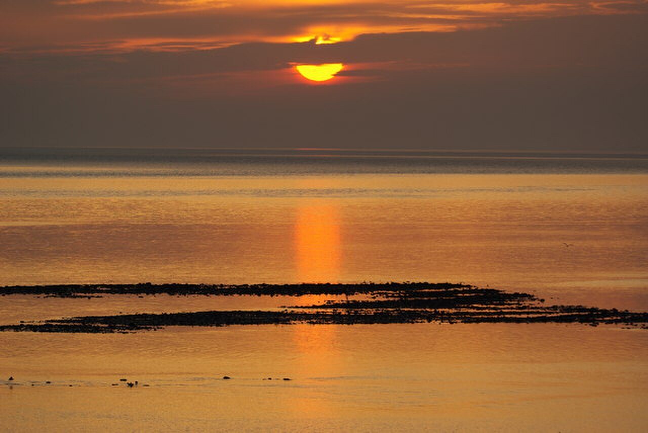 A winter sunset on the Solway coast, illustrating changing daylight.